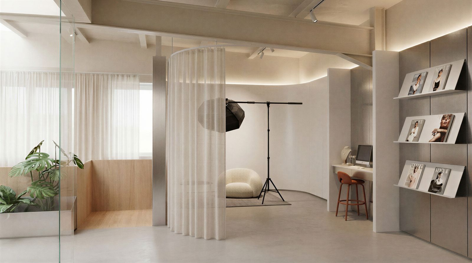 Bright studio interior with a curved sheer curtain, photo set and magazine wall